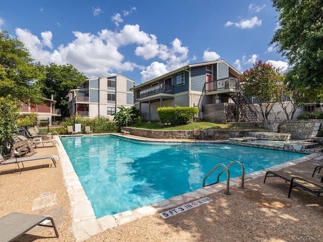 view of swimming pool featuring a patio