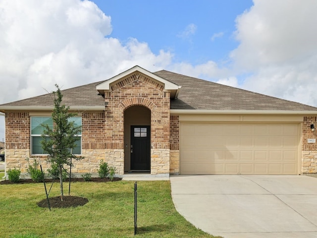 single story home with a front yard and a garage