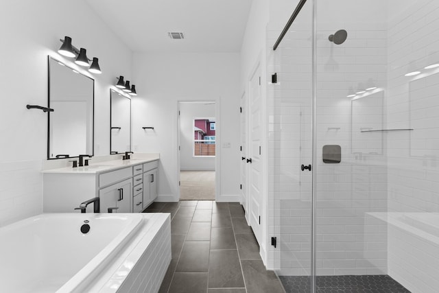 bathroom featuring vanity, tile patterned floors, and independent shower and bath