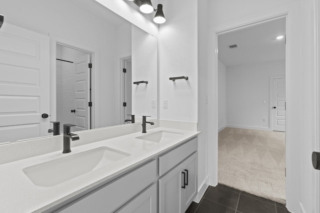 bathroom with vanity and tile patterned flooring