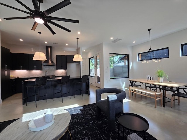 living room with sink and ceiling fan