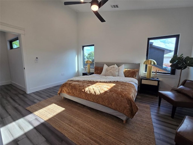 bedroom featuring high vaulted ceiling, dark hardwood / wood-style floors, and ceiling fan