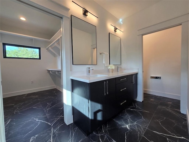 bathroom with tile flooring and vanity