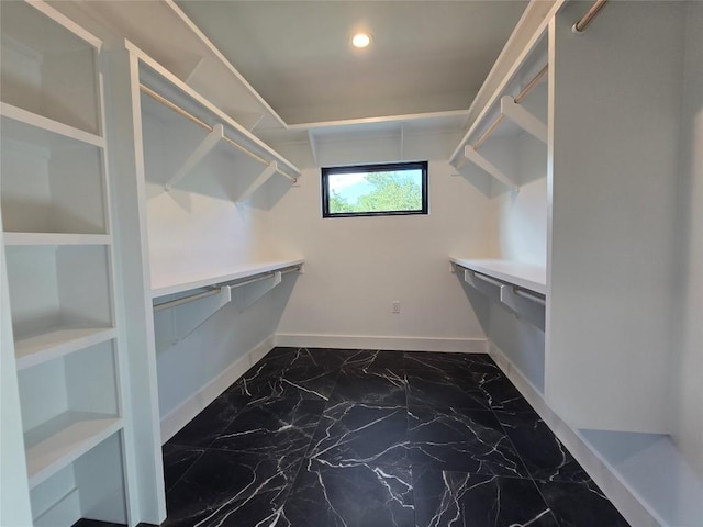 spacious closet with tile flooring