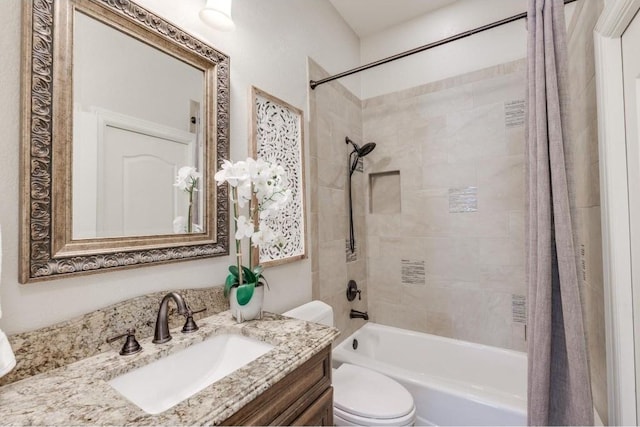 full bathroom featuring vanity, shower / bath combo, and toilet