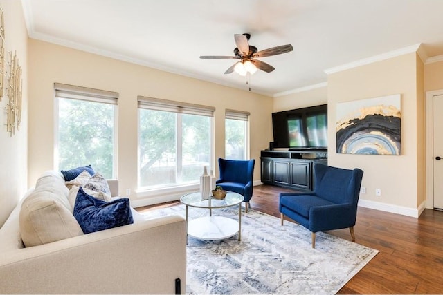 living room with ceiling fan, dark hardwood / wood-style flooring, and ornamental molding