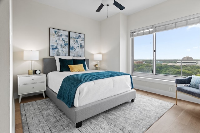 bedroom featuring ceiling fan and light hardwood / wood-style flooring