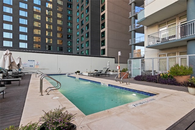 view of swimming pool with a patio