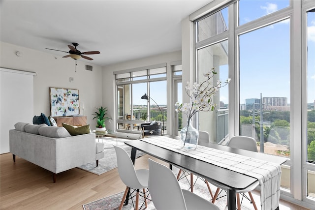 dining space featuring ceiling fan, plenty of natural light, and light wood-type flooring