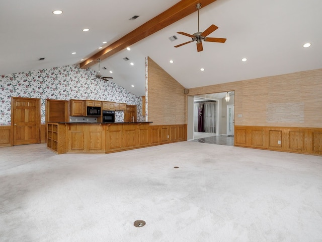 unfurnished living room featuring high vaulted ceiling, light carpet, and ceiling fan