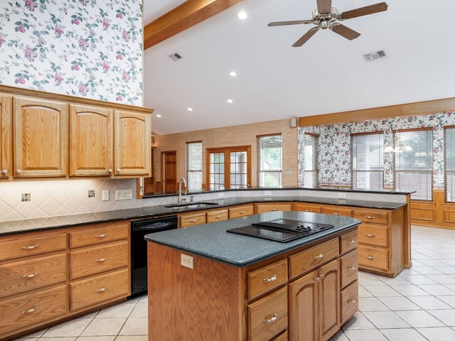 kitchen featuring kitchen peninsula, beamed ceiling, black appliances, light tile floors, and a center island