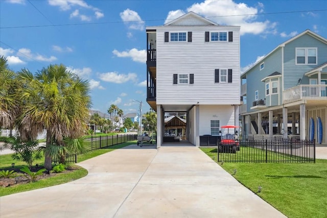 view of front facade featuring a front lawn and a carport