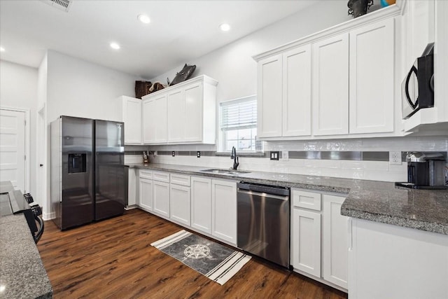 kitchen with stainless steel dishwasher, white cabinets, sink, and black refrigerator with ice dispenser