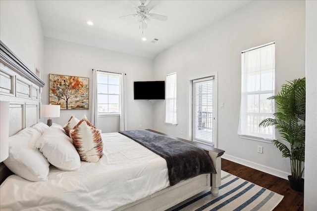 bedroom with dark hardwood / wood-style flooring, access to outside, and ceiling fan