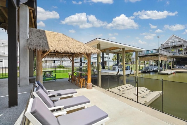 exterior space featuring a water view and an outdoor bar