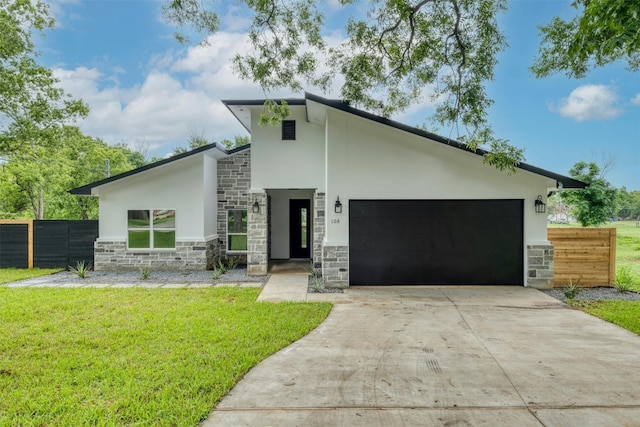 modern home featuring a front lawn and a garage