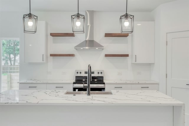 kitchen featuring electric stove, white cabinetry, pendant lighting, and island range hood