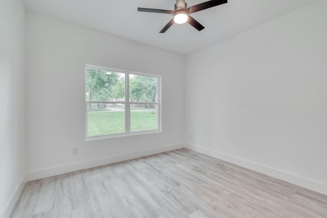 empty room with light hardwood / wood-style floors and ceiling fan