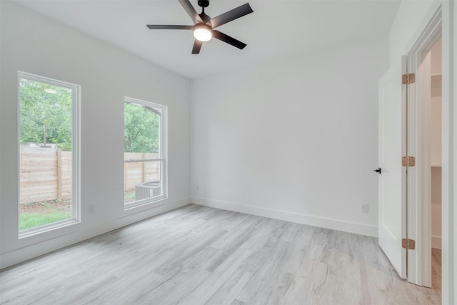 unfurnished room with light hardwood / wood-style flooring and ceiling fan