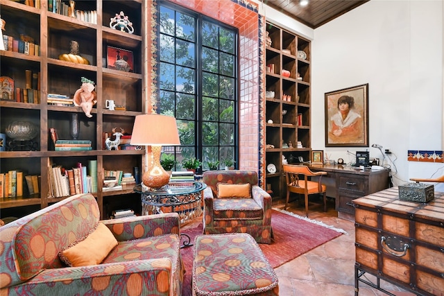 living area featuring tile floors and wood ceiling