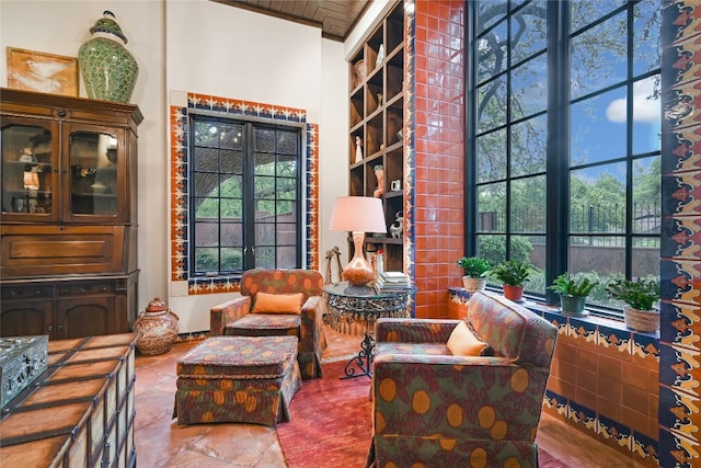 living area featuring tile floors, plenty of natural light, french doors, and wooden ceiling