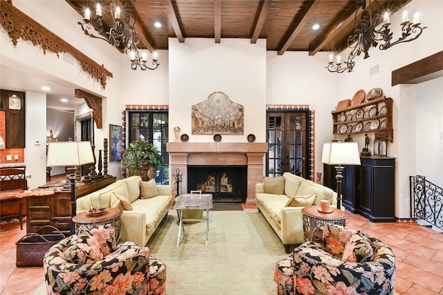 tiled living area featuring a high ceiling, a notable chandelier, and wood ceiling