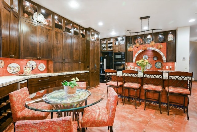 dining space featuring recessed lighting and light tile patterned floors
