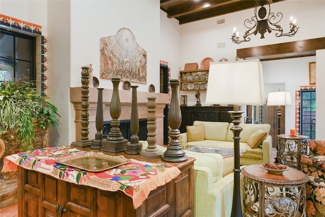 living room with a notable chandelier and beam ceiling