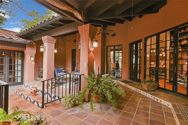 property entrance featuring ceiling fan, french doors, and a patio