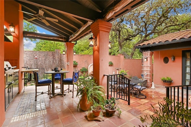 view of patio / terrace featuring outdoor dining area, ceiling fan, and a fenced backyard