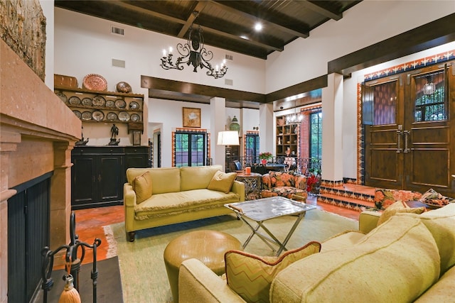 tiled living room featuring high vaulted ceiling, beamed ceiling, a chandelier, and wood ceiling