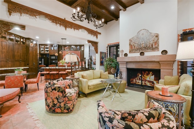 living room with beamed ceiling, tile floors, a chandelier, and a high ceiling