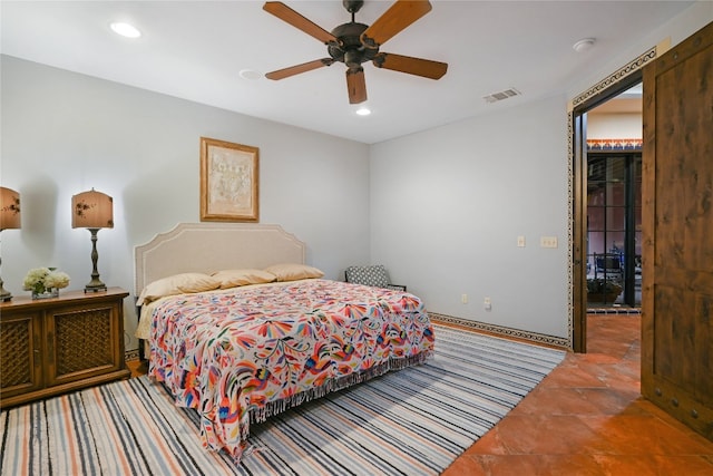 bedroom featuring tile floors and ceiling fan