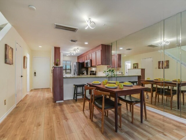 dining room featuring light wood-type flooring