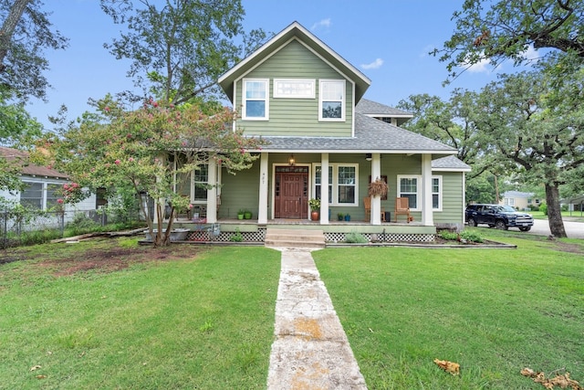 view of front of home featuring covered porch and a front lawn