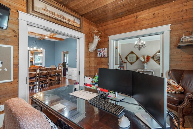 office space featuring wooden walls, wooden ceiling, and an inviting chandelier