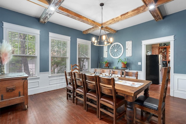 dining room with beamed ceiling, coffered ceiling, a chandelier, and dark hardwood / wood-style flooring