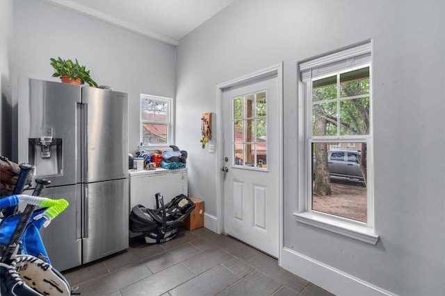 entryway featuring dark tile patterned flooring