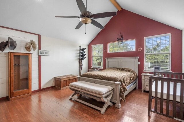 bedroom with beam ceiling, wood-type flooring, high vaulted ceiling, and ceiling fan