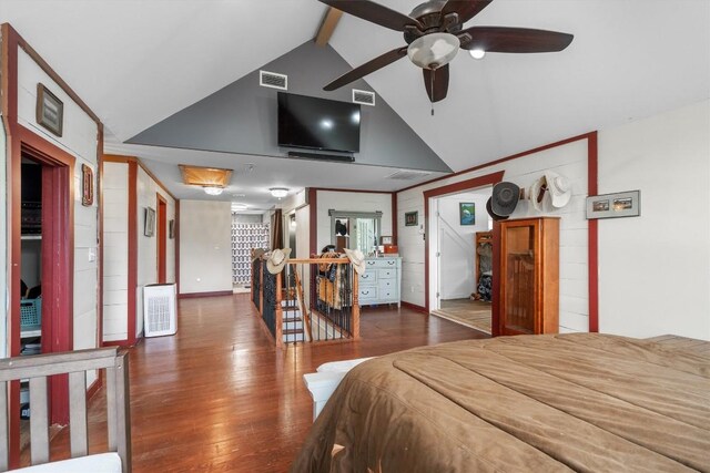 bedroom featuring dark hardwood / wood-style flooring and lofted ceiling with beams