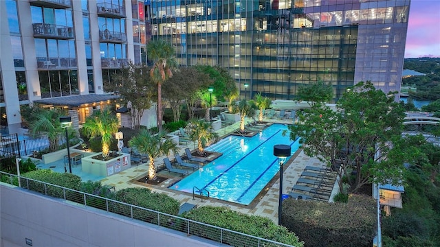 view of pool at dusk