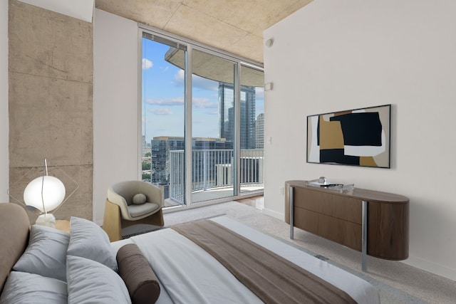 bedroom with access to outside and floor to ceiling windows