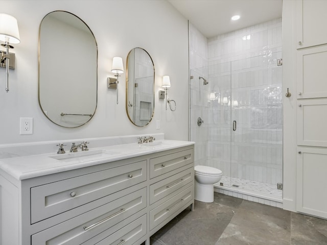 bathroom with a shower with shower door, tile flooring, double sink vanity, and toilet