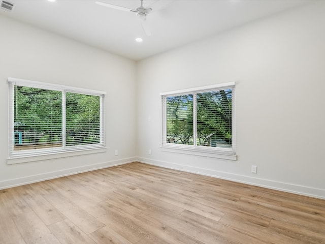 unfurnished room featuring ceiling fan and light hardwood / wood-style floors