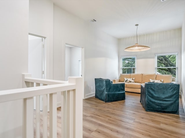 living area with light hardwood / wood-style flooring