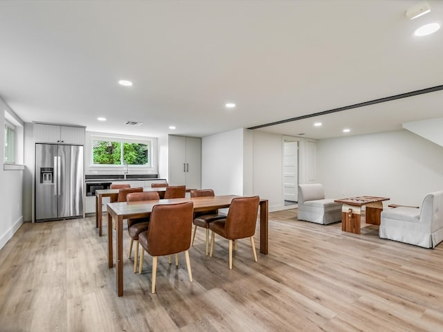 dining area with light hardwood / wood-style flooring