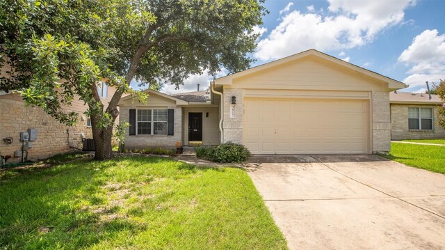 single story home with a garage, a front lawn, and central air condition unit