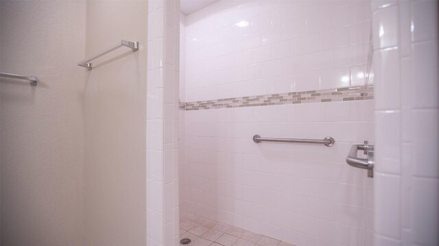 bathroom with a tile shower