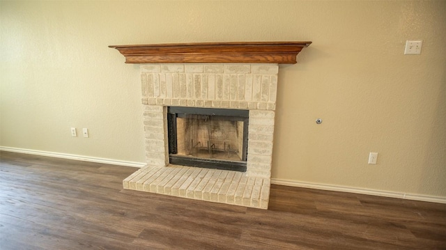 details featuring hardwood / wood-style flooring and a fireplace