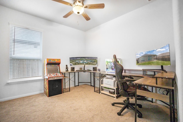 office space featuring ceiling fan and light colored carpet